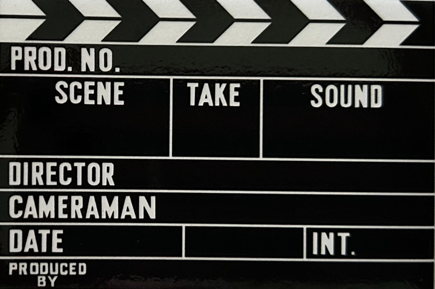 Movie Clap Board On a 2”x3” Metal Refrigerator Magnet. Quality Glossy Finish With Strong Holding Power.